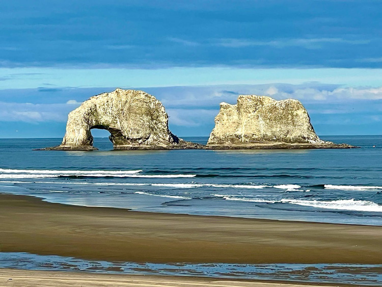 Iconic Twin Rocks formation seen from Twin Rocks Turnaround Park in Rockaway Beach OR. Iconic Twin Rocks formation seen from Twin Rocks Turnaround Park in Rockaway Beach OR.